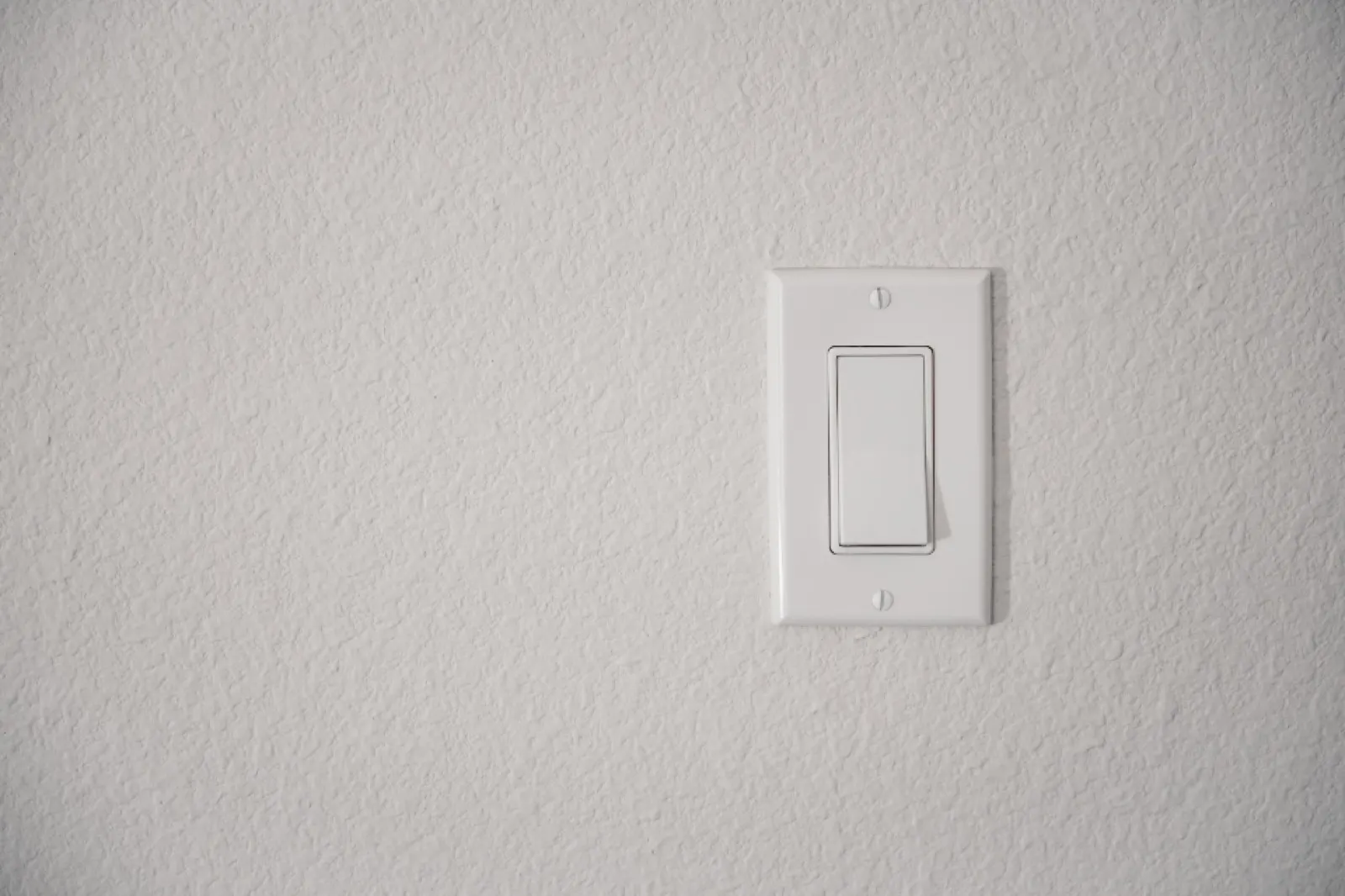Minimal white wall switch