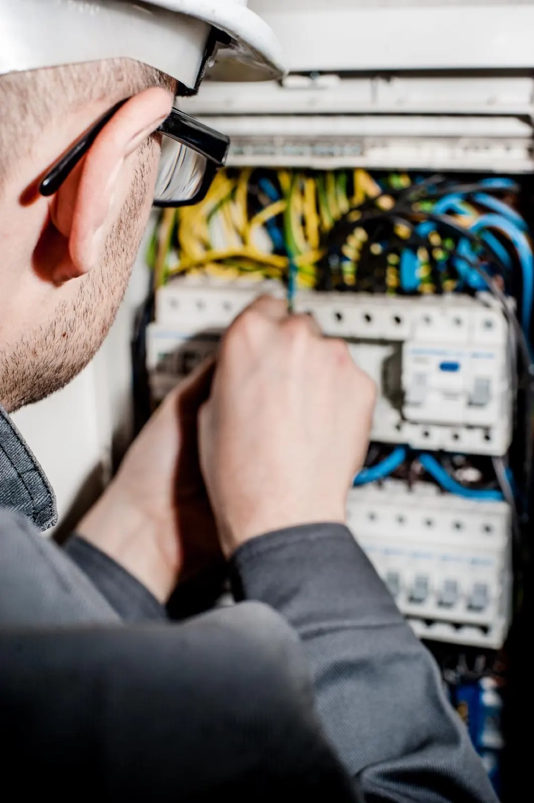Electrician wiring a distribution board